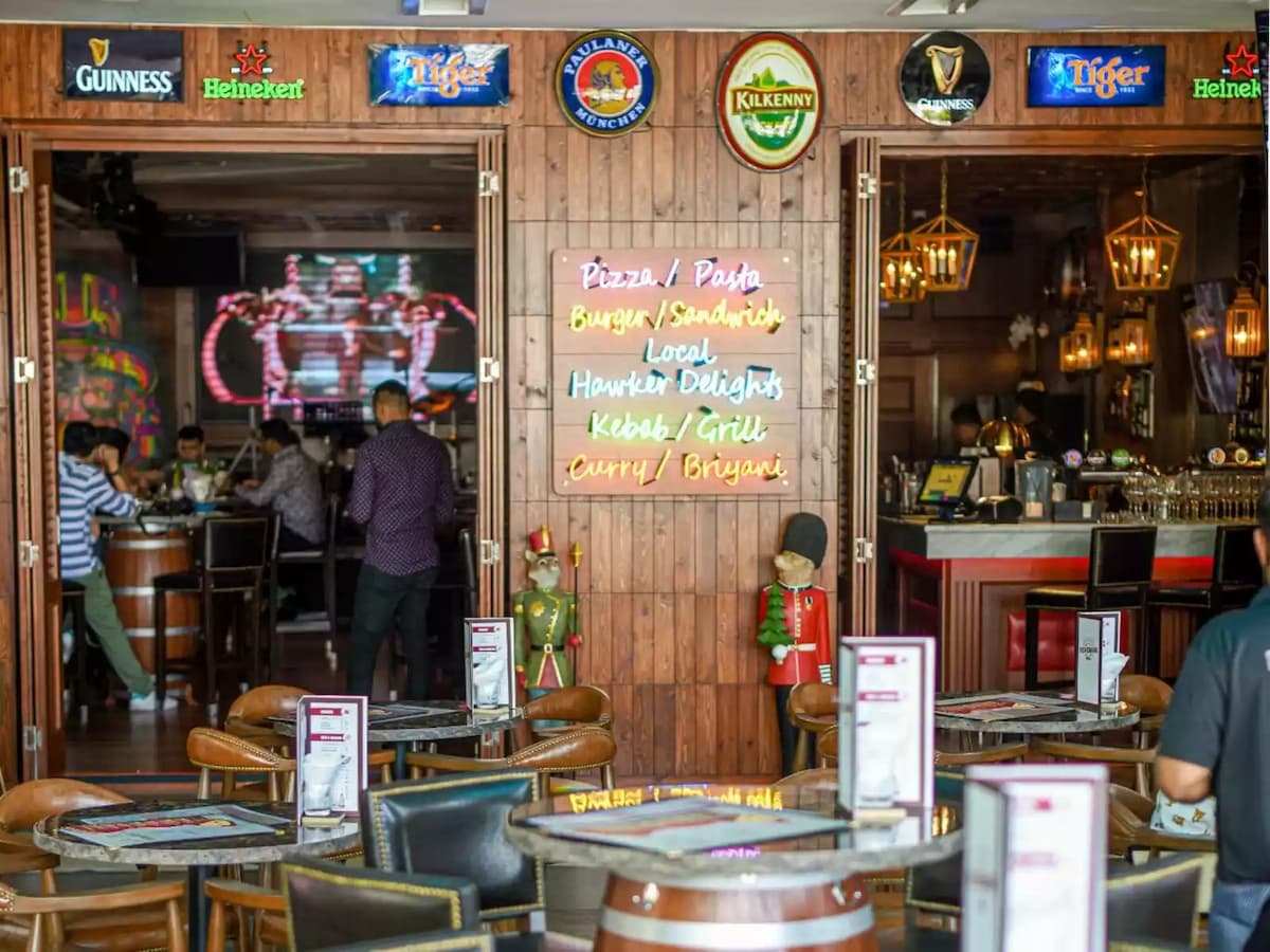 a kitchen bar with logo designs and old wood vibes