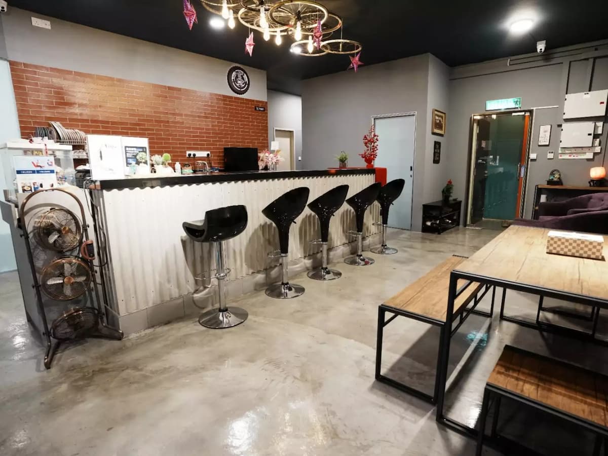 lounge area with bar counter and modern seating at inner journey meditation center in kuala lumpur