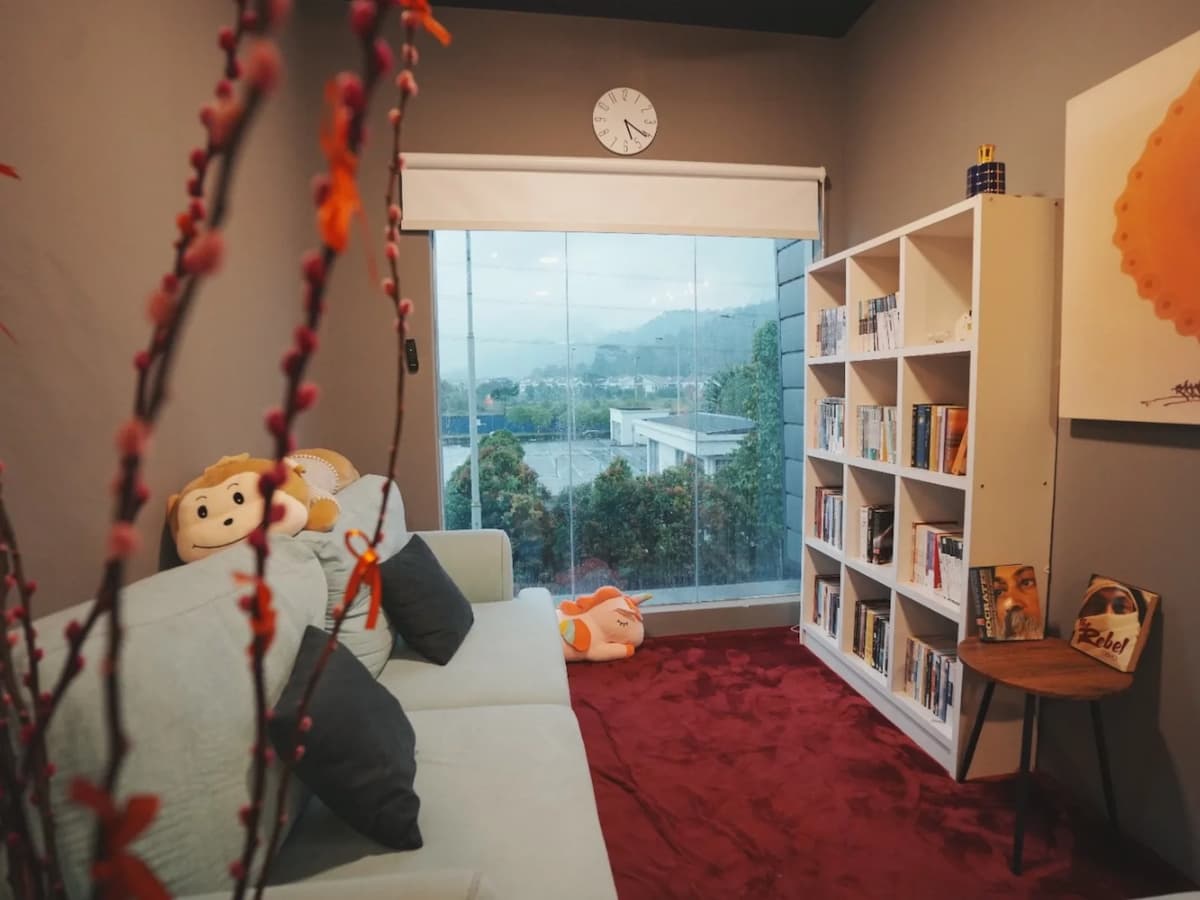 private reading lounge with comfortable seating and scenic view at inner journey meditation center in kl