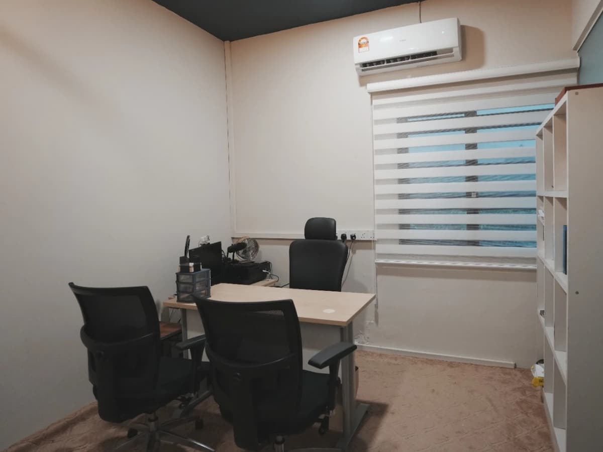 counseling office with desk and comfortable chairs at inner journey meditation center in kl