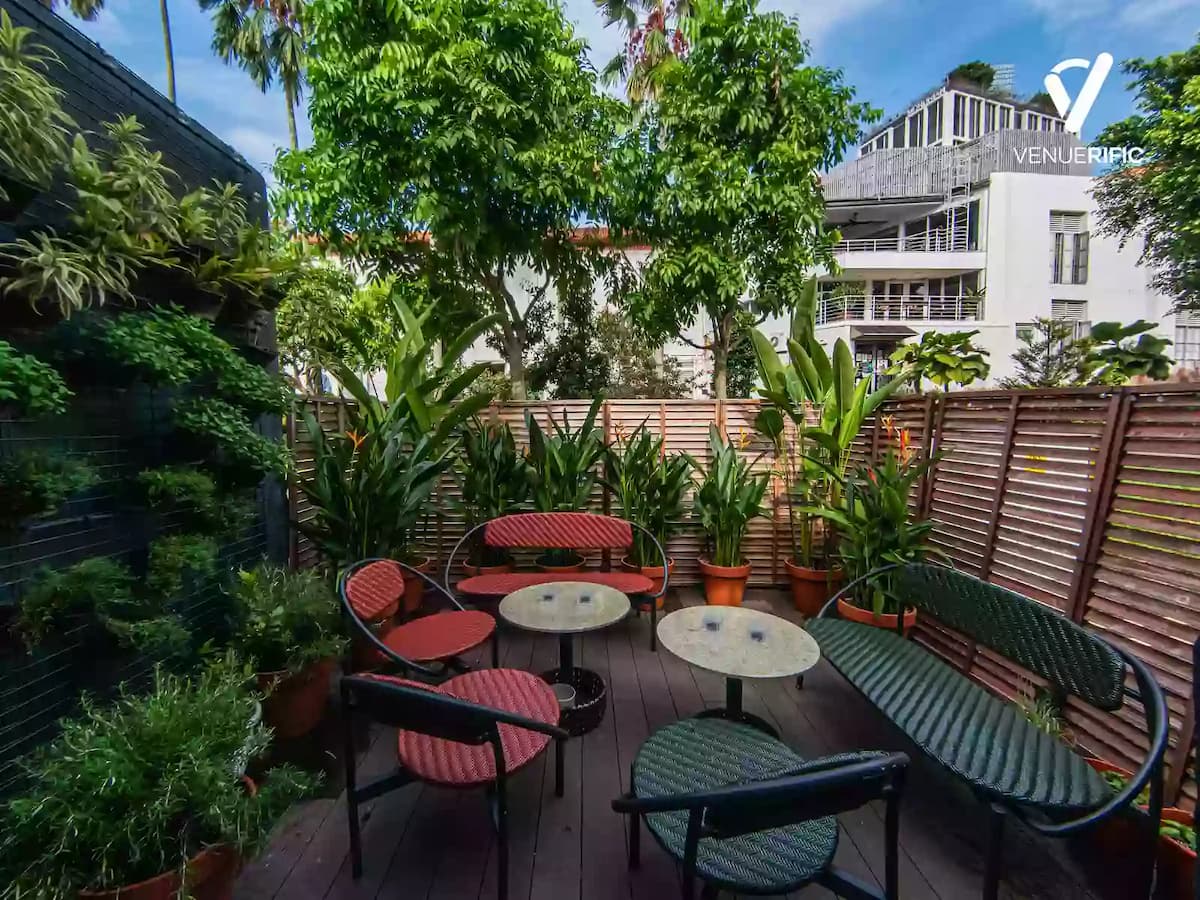 outdoor garden lounge area with lush greenery and seating