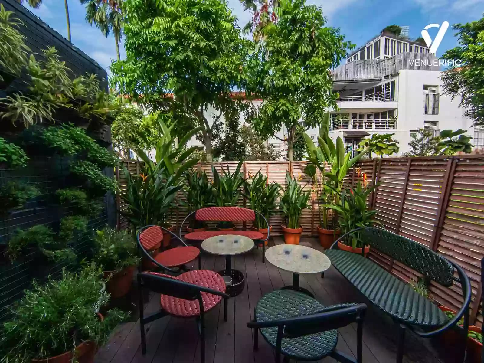 outdoor garden lounge area with lush greenery and seating