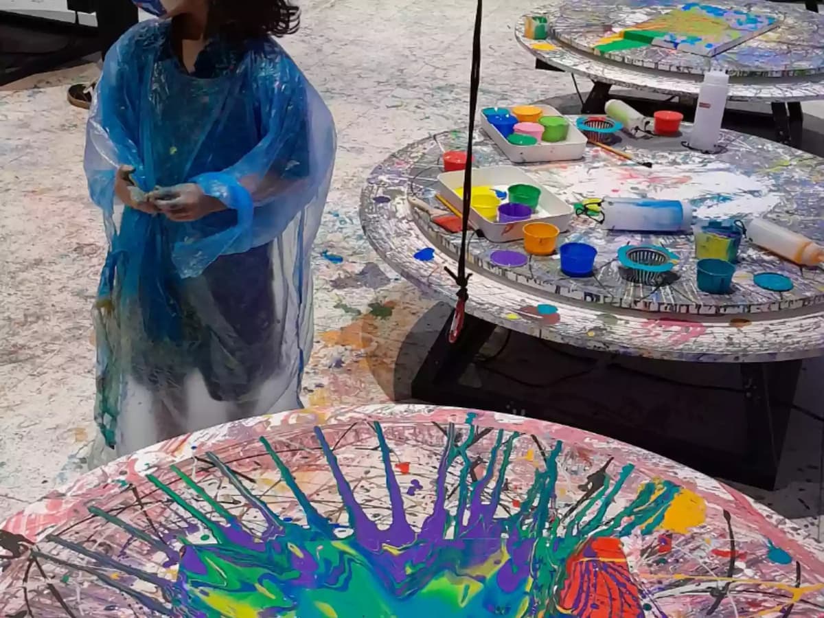colorful splatter art with paint supplies