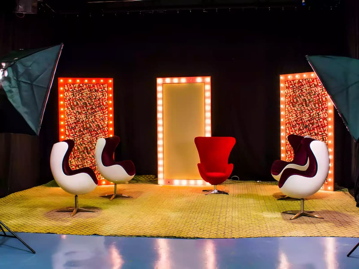 a stylish studio setup featuring four contemporary chairs in white and red