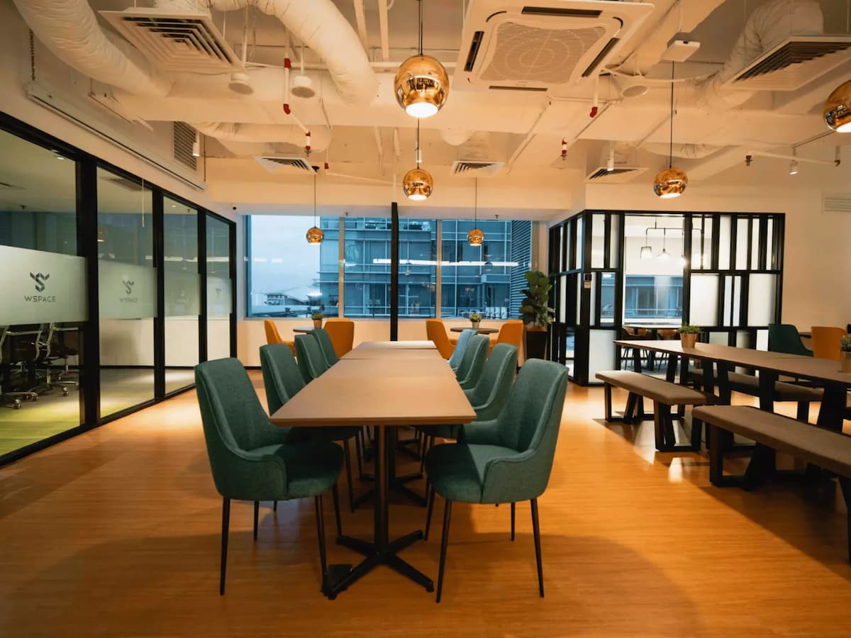 a modern and stylish coworking space with sleek furniture and warm lighting