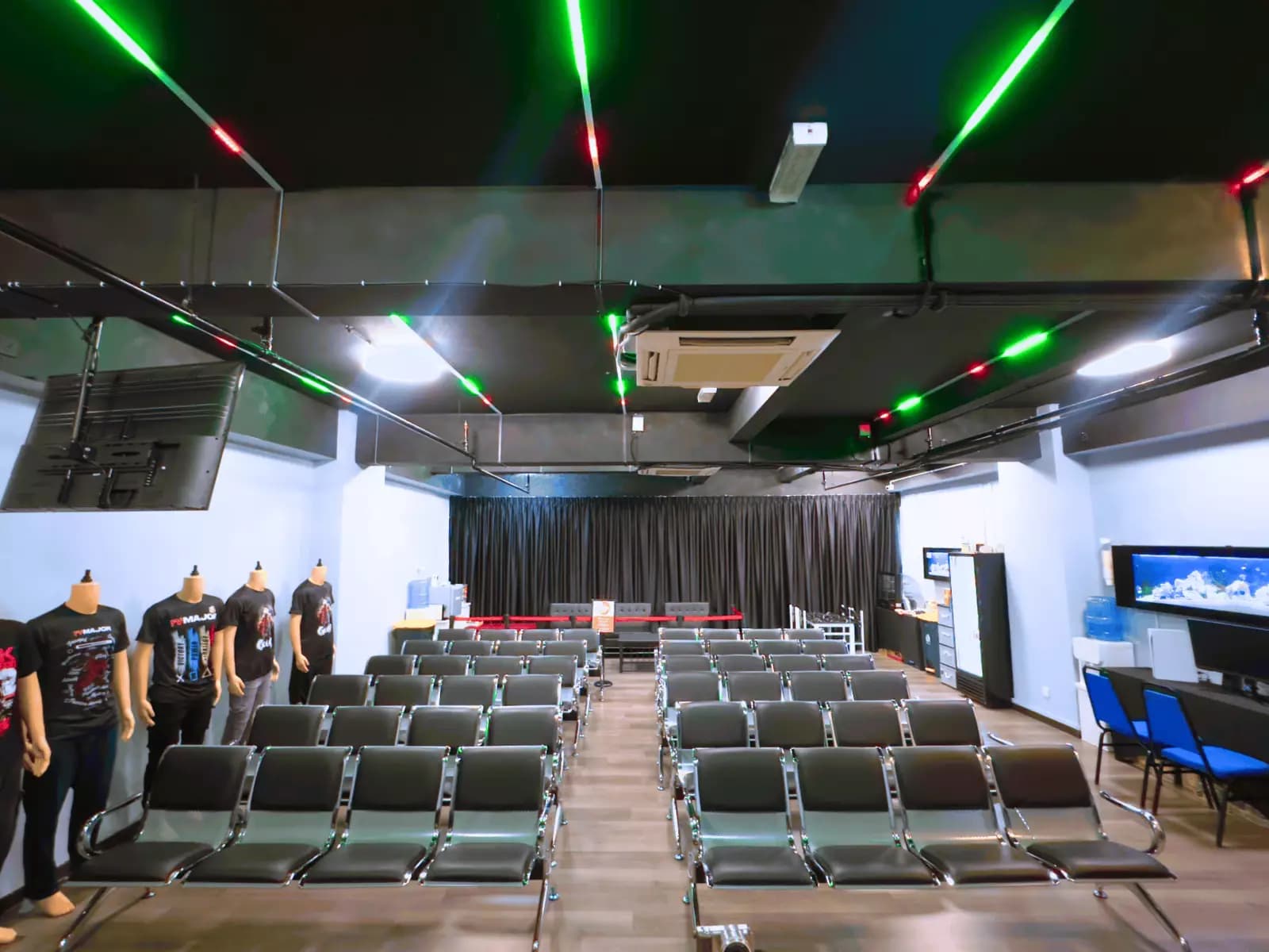a space with rows of chairs and mannequins on display
