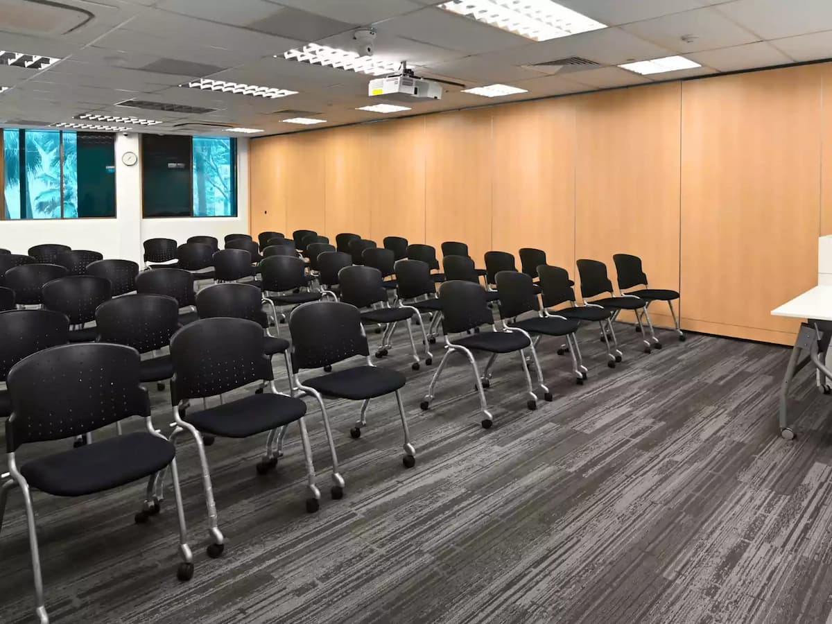 rows of black ergonomic chairs in theatre set up