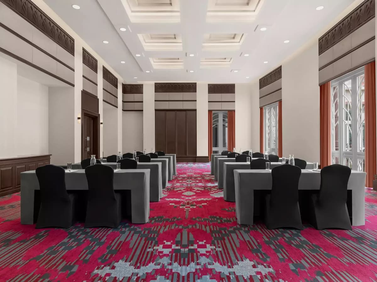 table setup with black chairs and grey tables