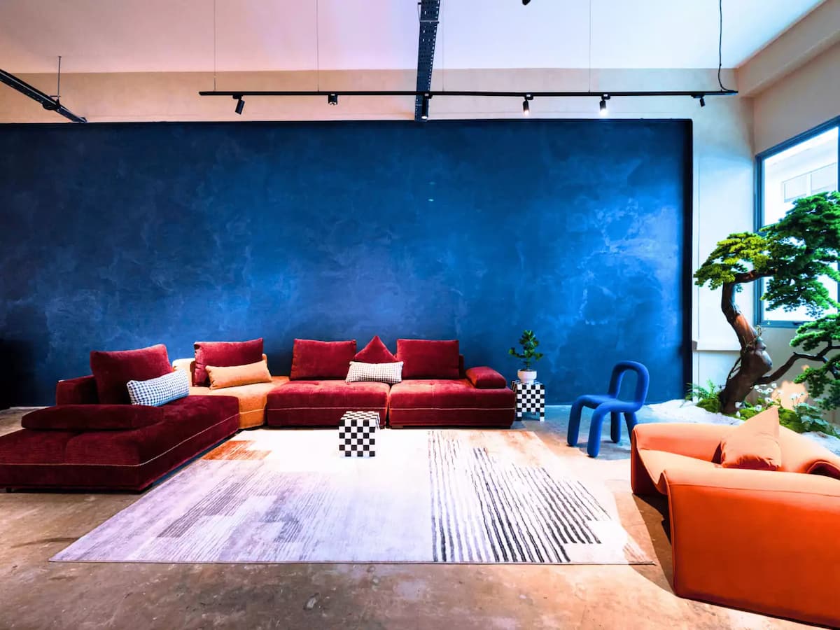 Colorful lounge area with blue wall and modern furniture
