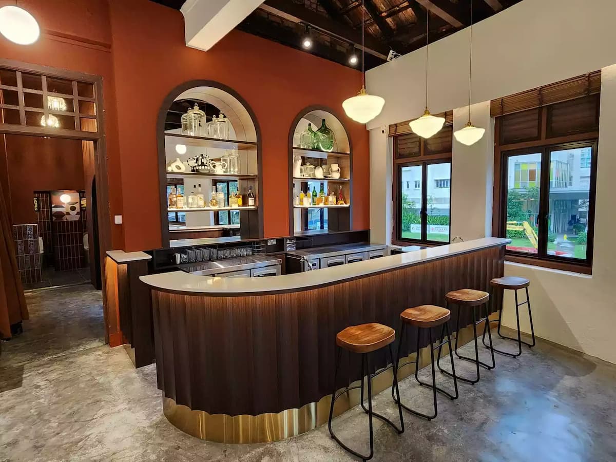 Vintage-style curved bar with dark wood panelling
