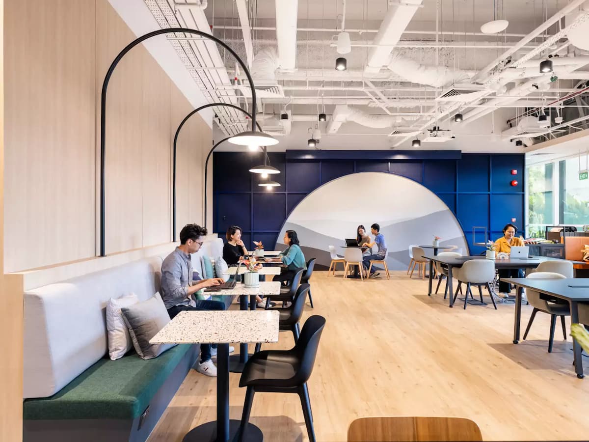 Modern coworking with casual seating and collaborative workspace.