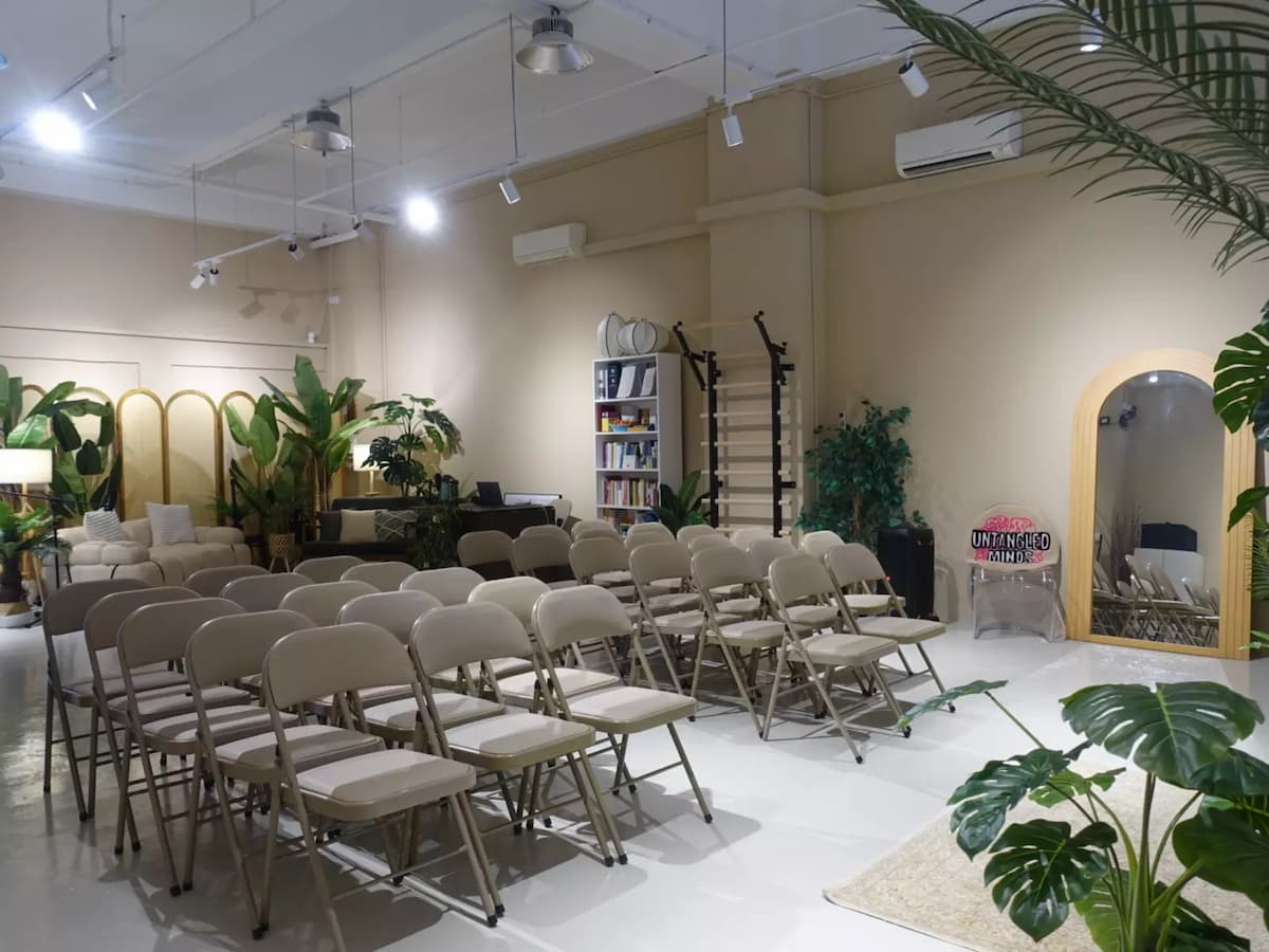 spacious event space with rows of folding chairs