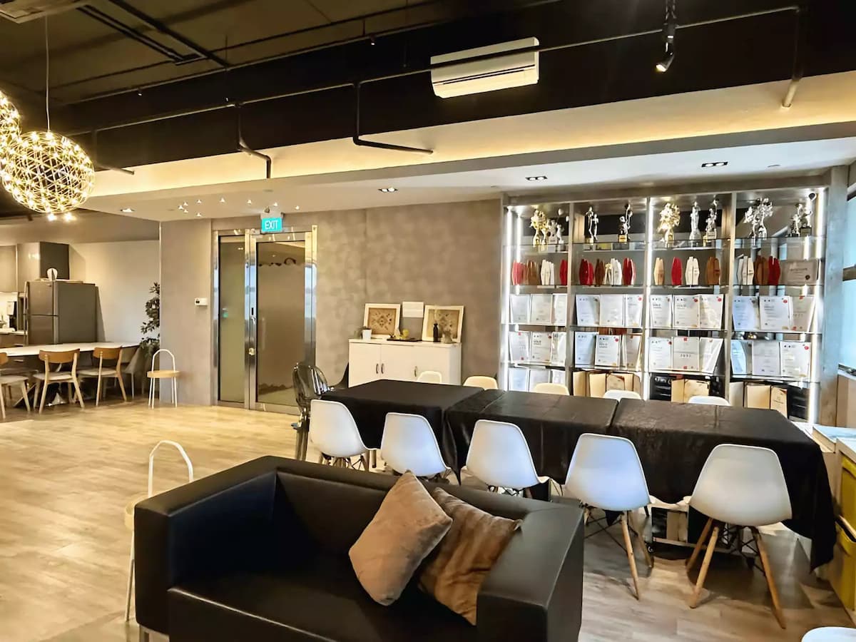 Elegant event space with dining setup and modern lounge seating.