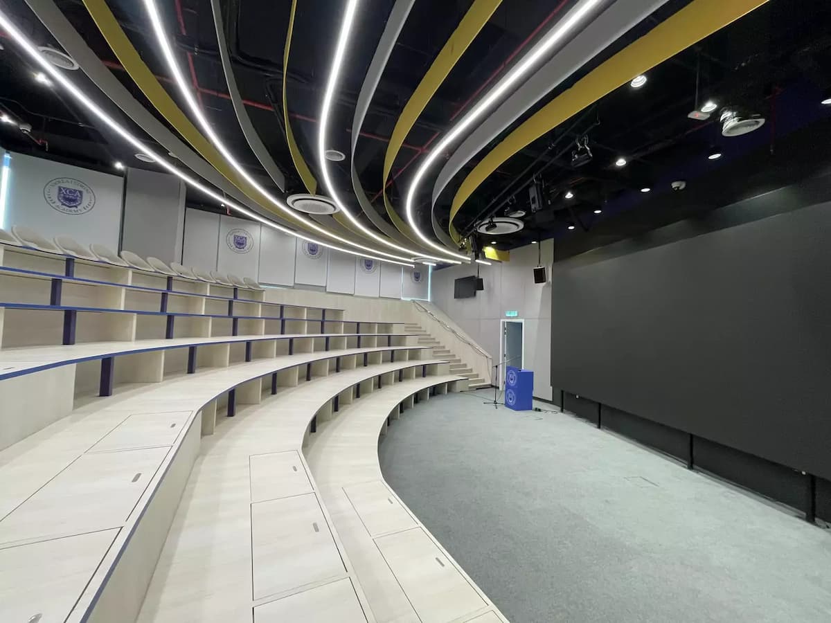 tiered lecture theatre seating facing a large screen at an event and training hub near mid valley kuala lumpur