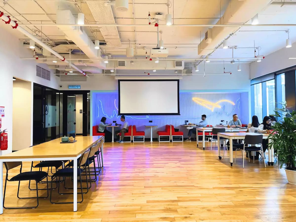 workshop event space with projector screen tables and seating at wework equatorial plaza in kuala lumpur