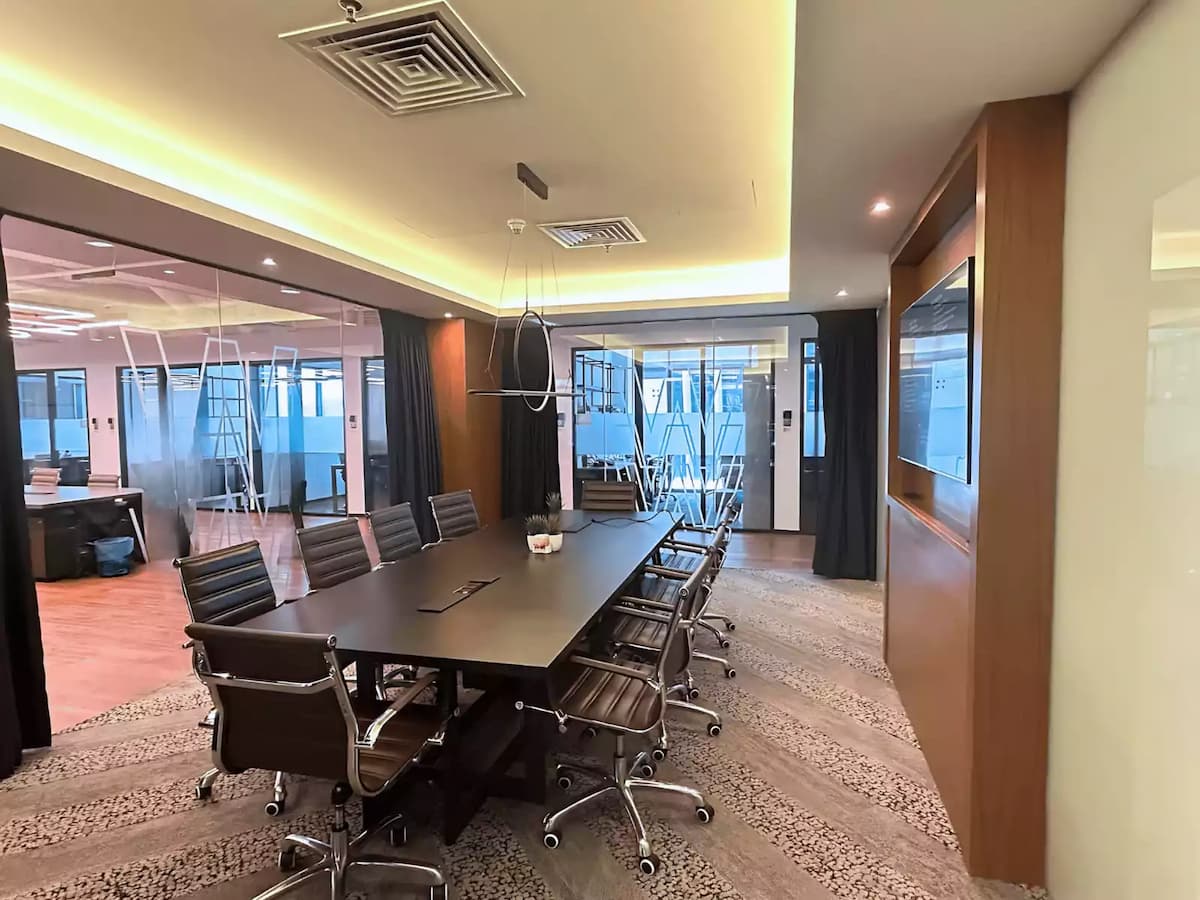 wide angle view of a training and workshop event space with glass partitions and executive chairs near klcc kuala lumpur
