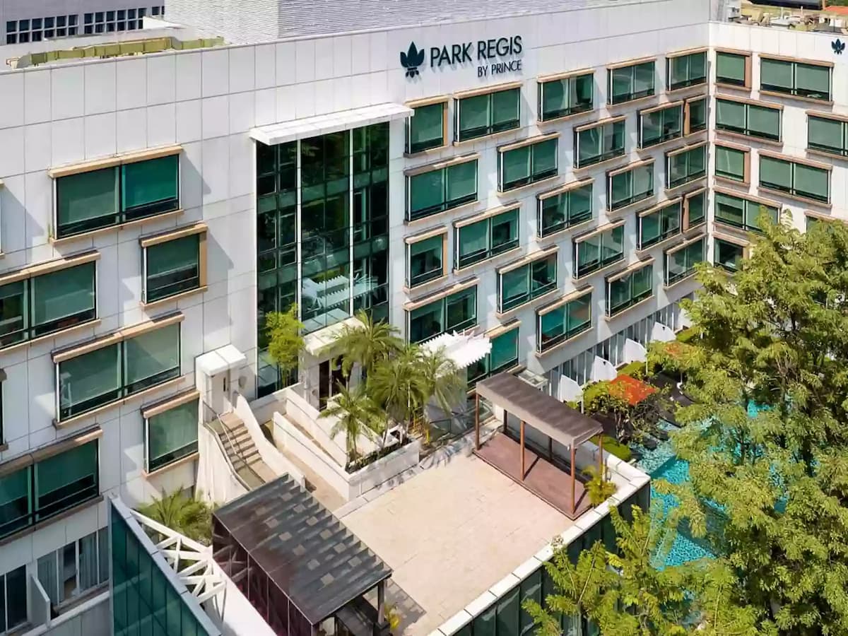 Park Regis hotel exterior with terrace and pool views.