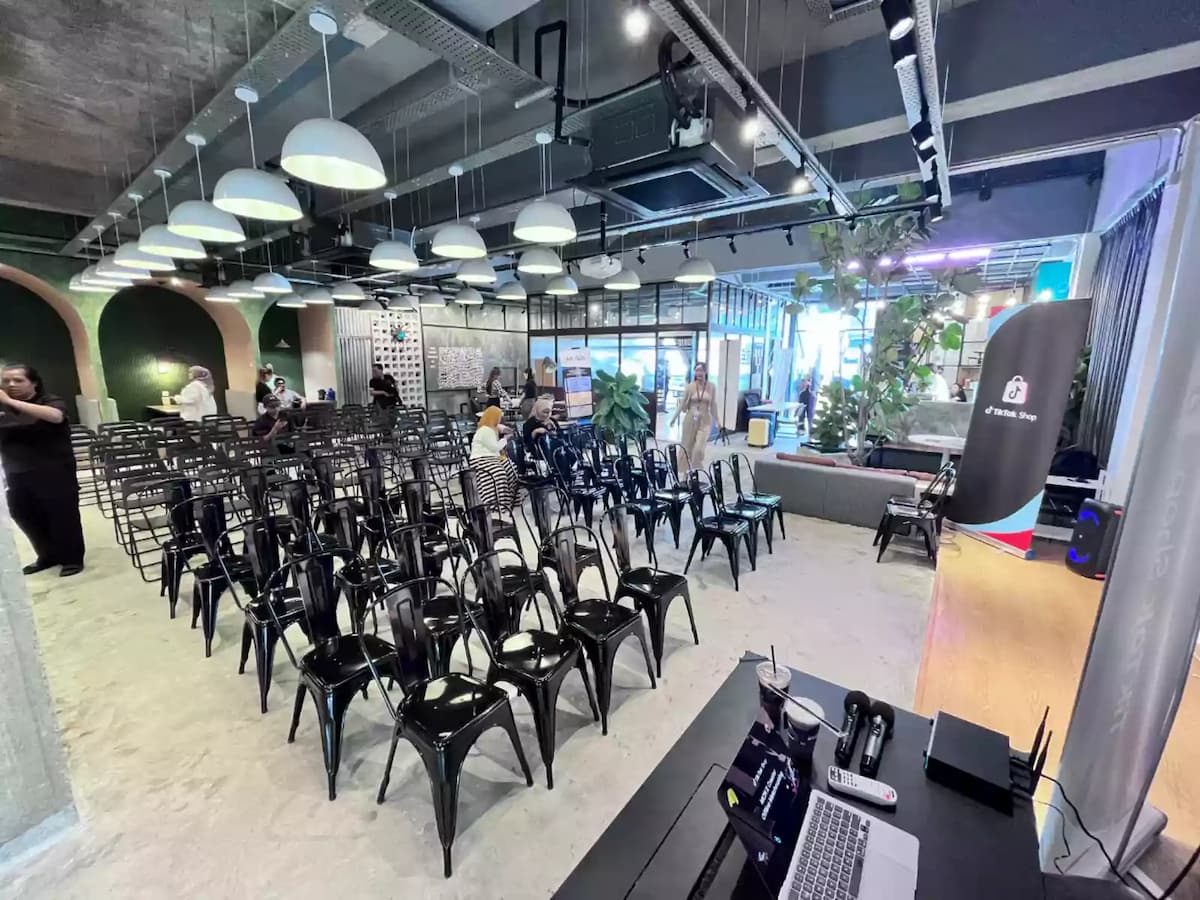 guests seated for a product launch beside a branded backdrop at an event venue in bandar sunway