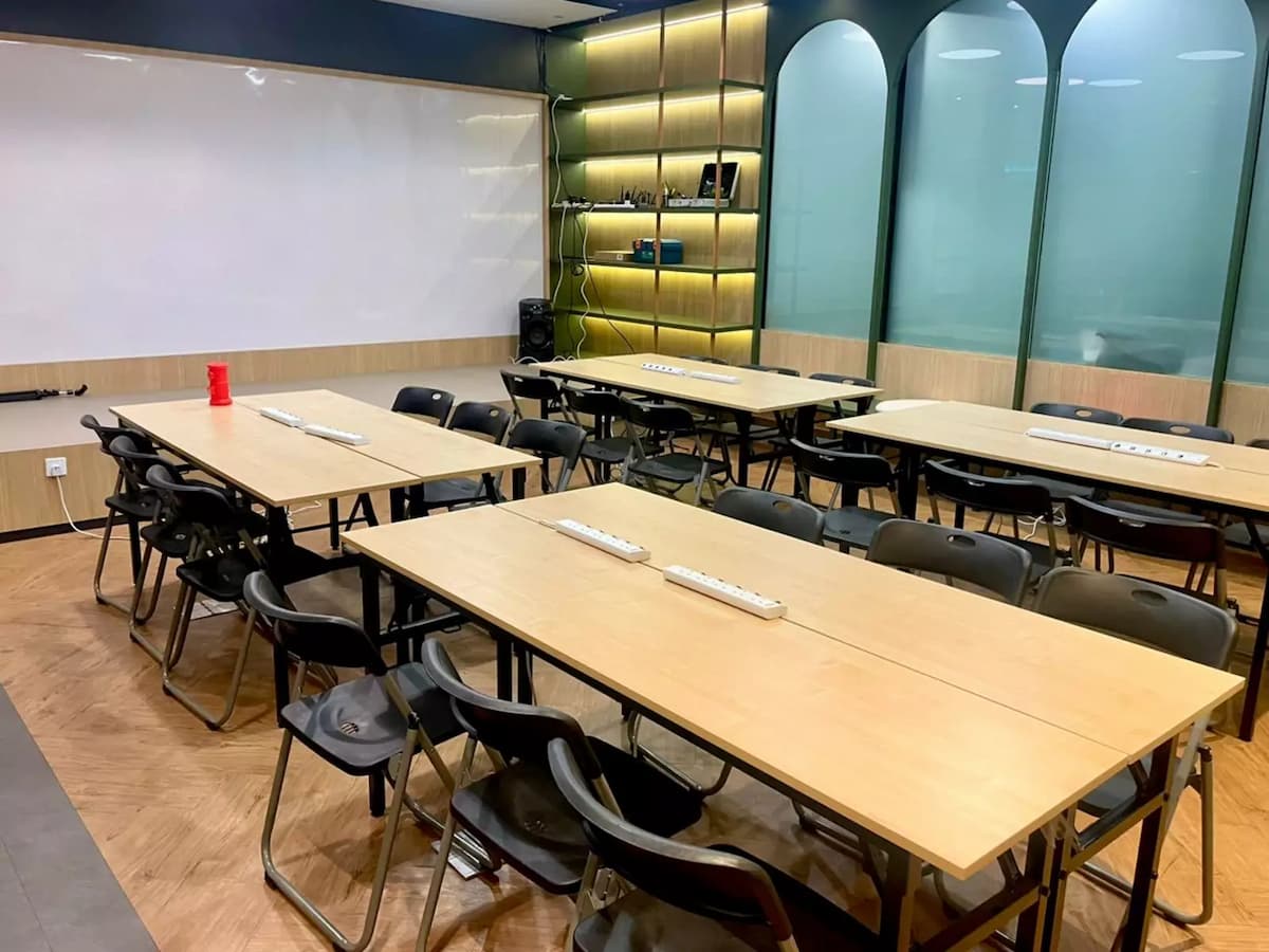 classroom style tables and folding chairs facing a whiteboard at event loft training room in seri petaling kuala lumpur