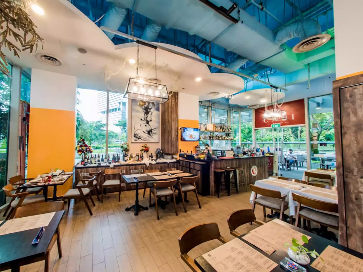 restaurant dining area and bar at cali rochester park private event venue in singapore