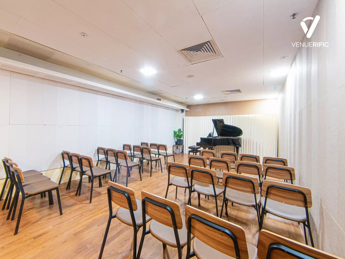 a small room with chairs and a piano in singapore