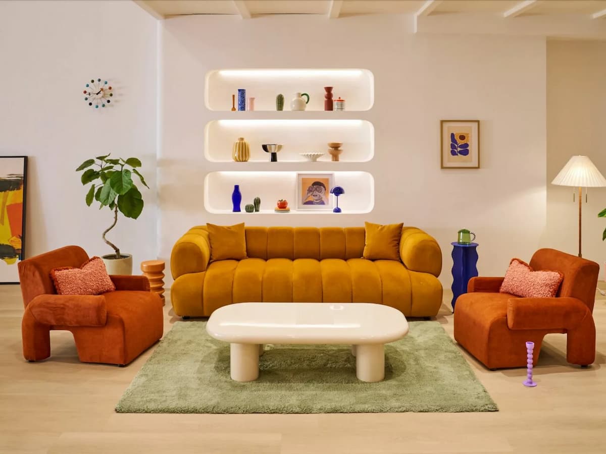 retro styled lounge seating area with mustard sofa and armchairs at studio colour party venue singapore