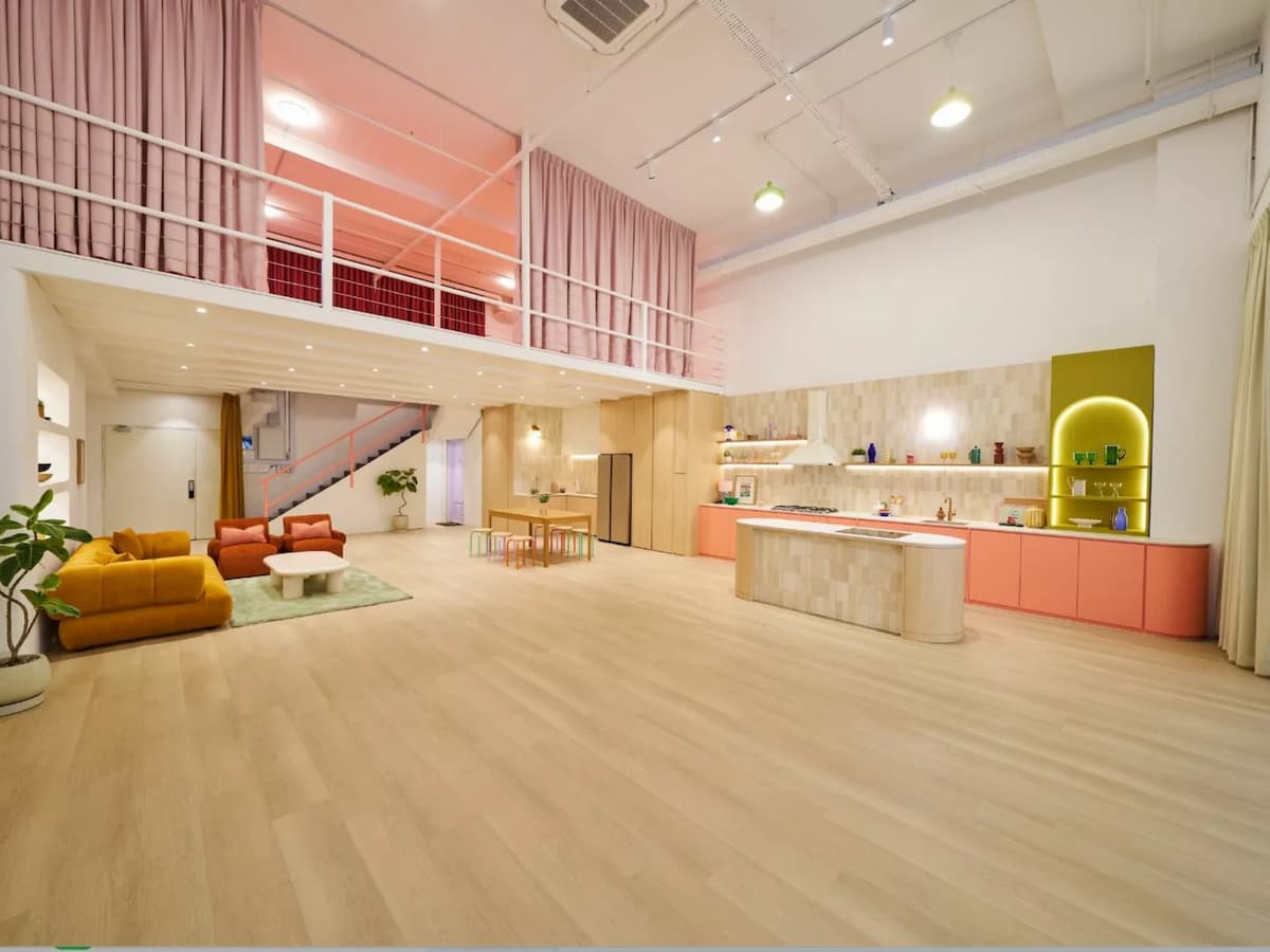 spacious double height loft event space with mezzanine lounge and open kitchen at studio colour singapore