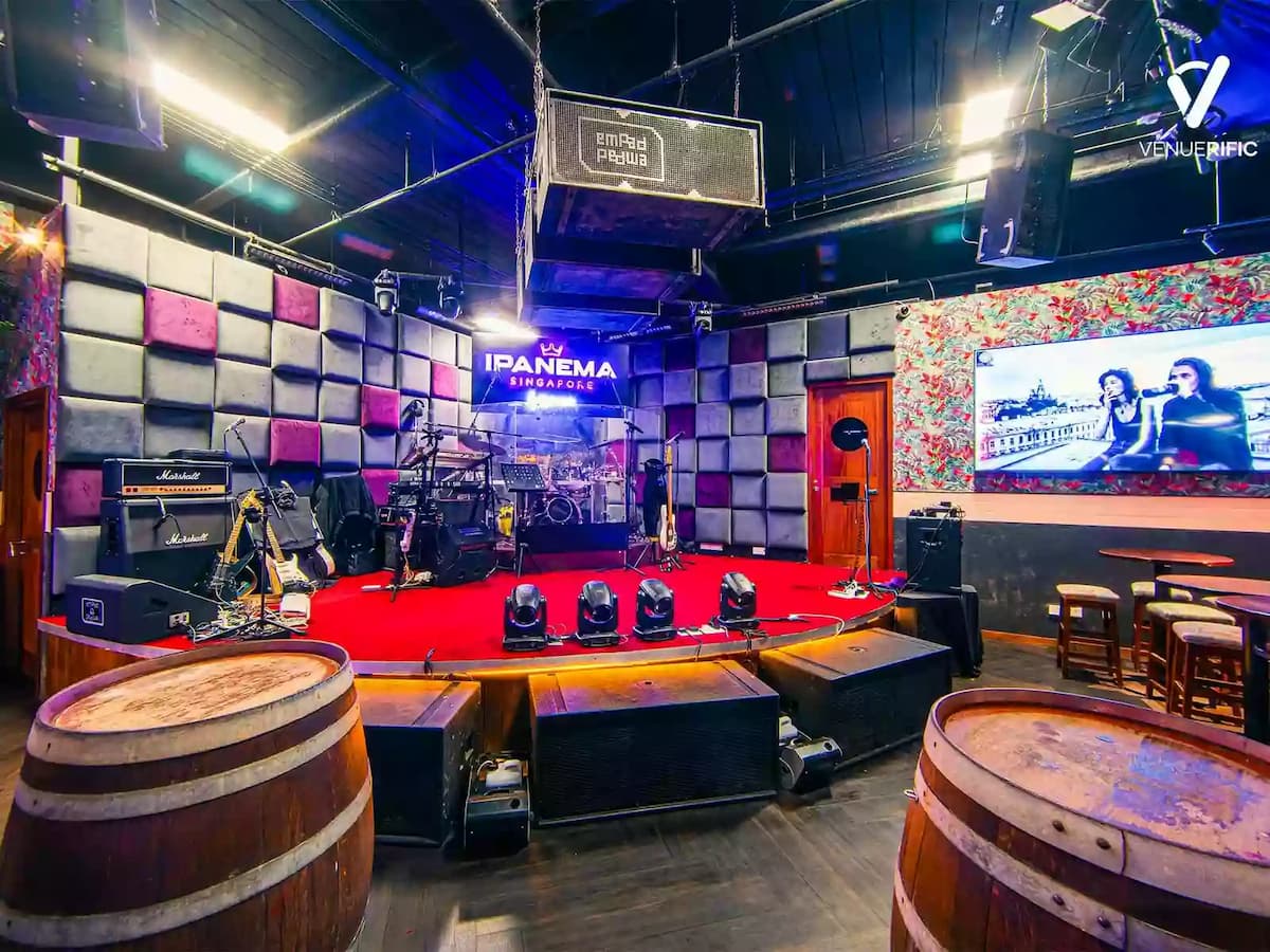 Live music stage with sound system and intimate event seating.