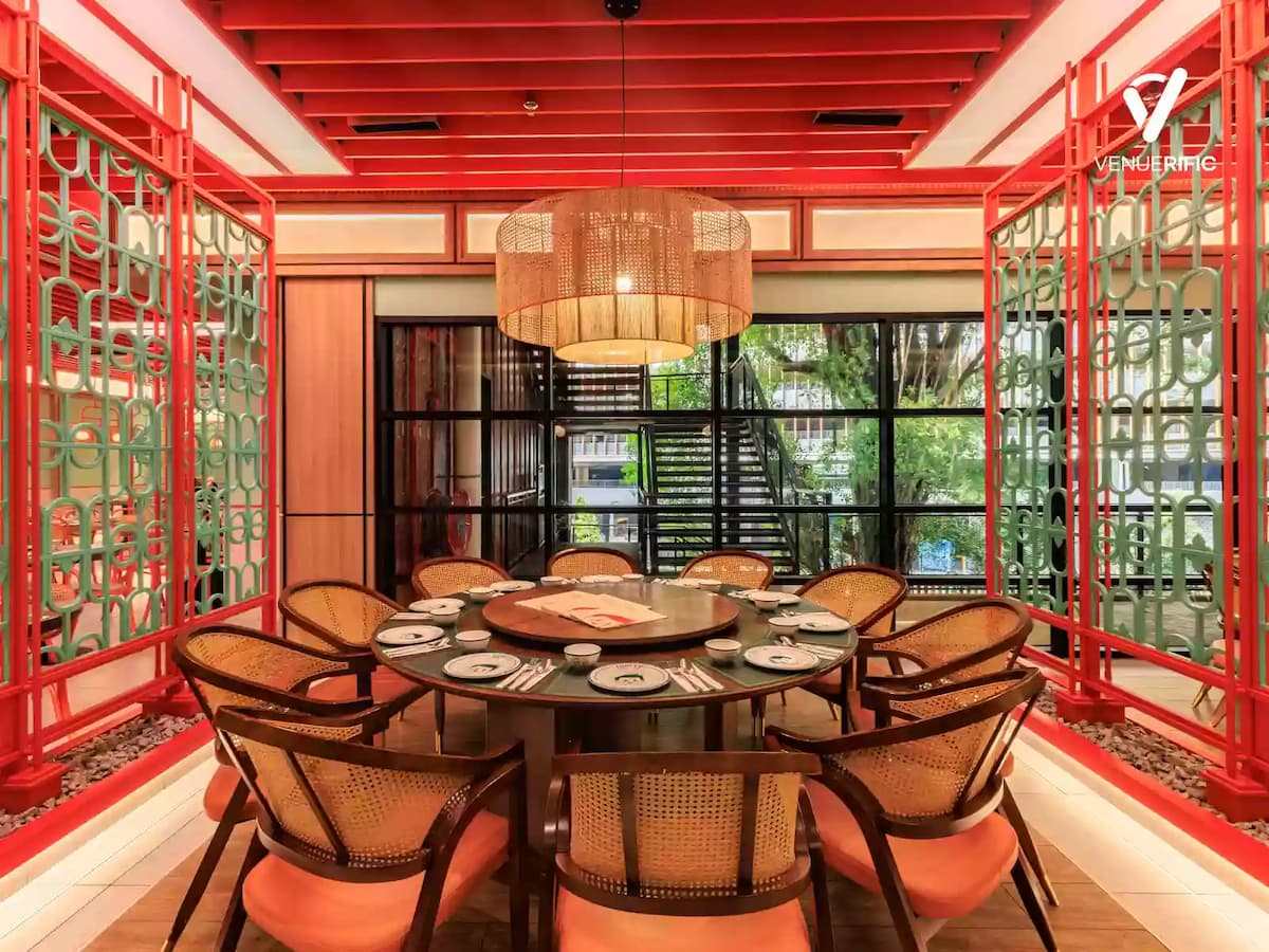 Elegant private dining area with a round banquet table, striking oriental-inspired interiors, and a warm, intimate ambiance, ideal for corporate dinners, family celebrations, festive gatherings, and VIP private dining.