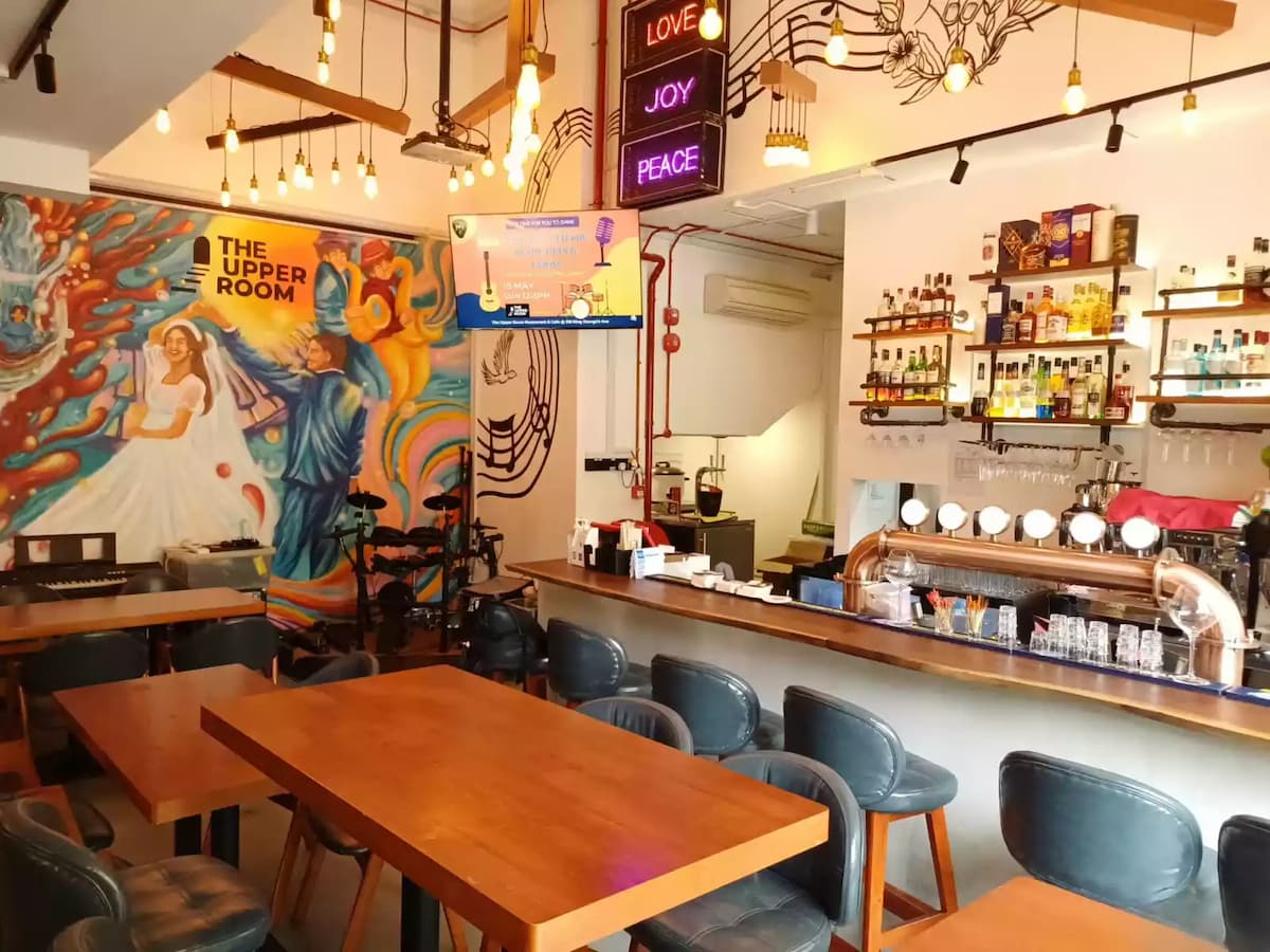 the upper room restaurant cafe bar counter with beer taps and mural event space in jalan besar singapore