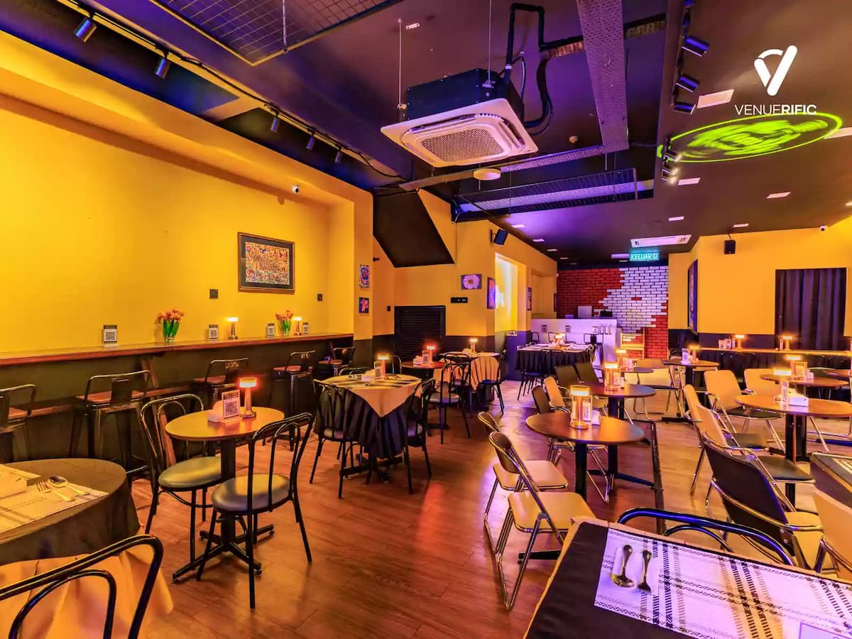purple neon lighting over round cocktail tables private event space in bandar sunway malaysia