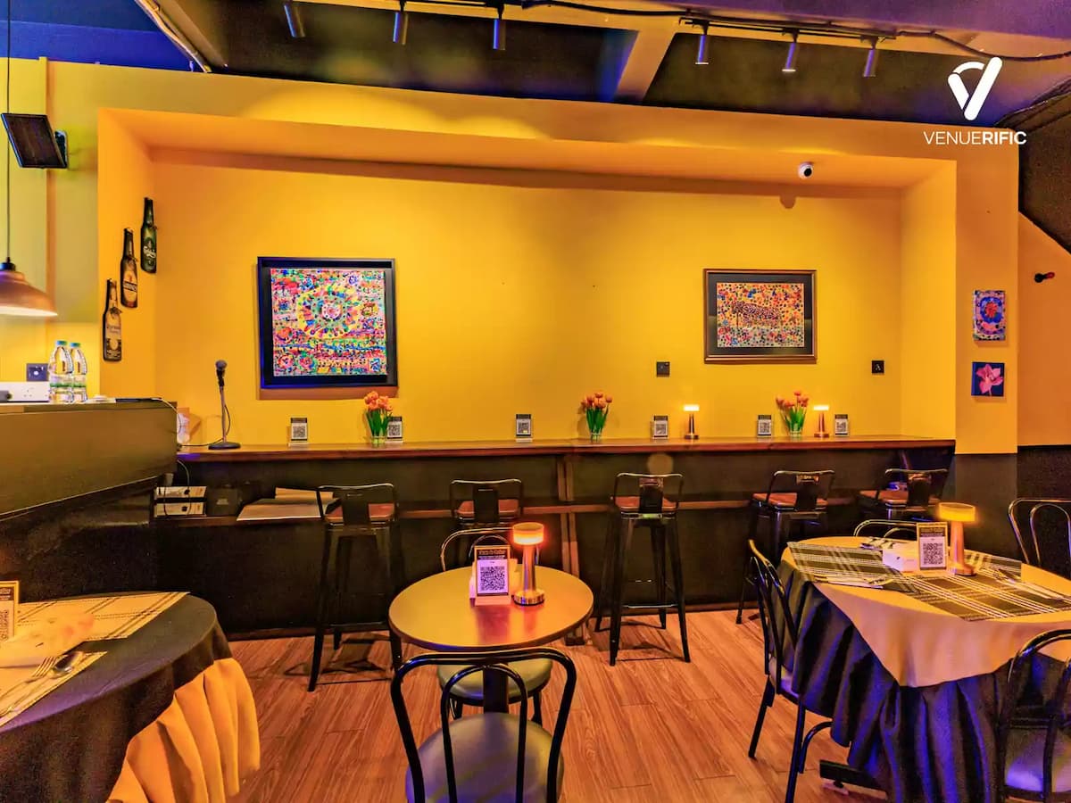 indoor bar and dining area lit in purple and amber at a corporate party event venue in bandar sunway malaysia