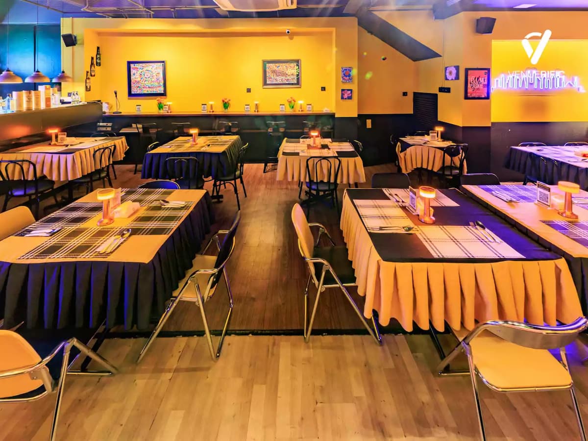 yellow themed dining tables with plaid table runners at kl comedy event space in bandar sunway