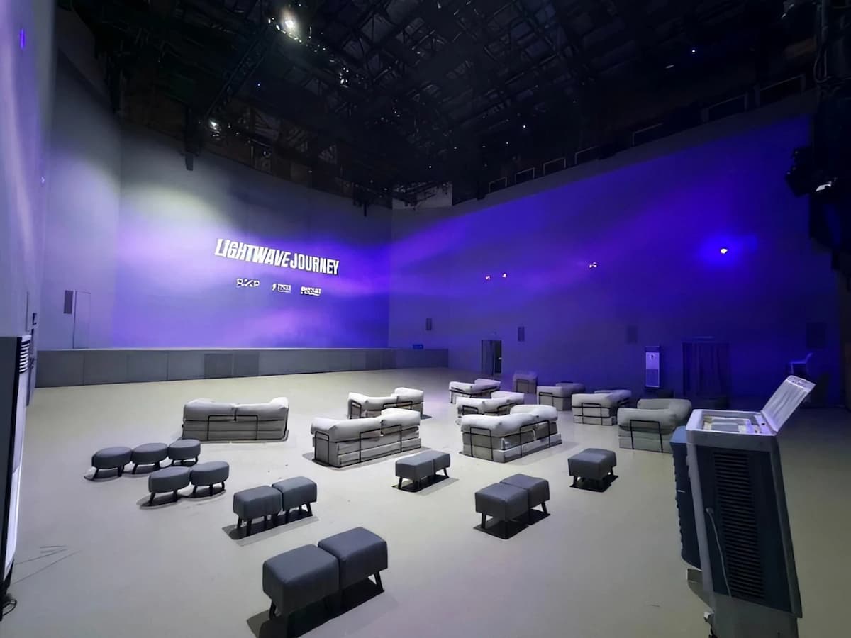 contemporary event space with dramatic purple lighting and flexible modular seating configuration at the experience kuala lumpur