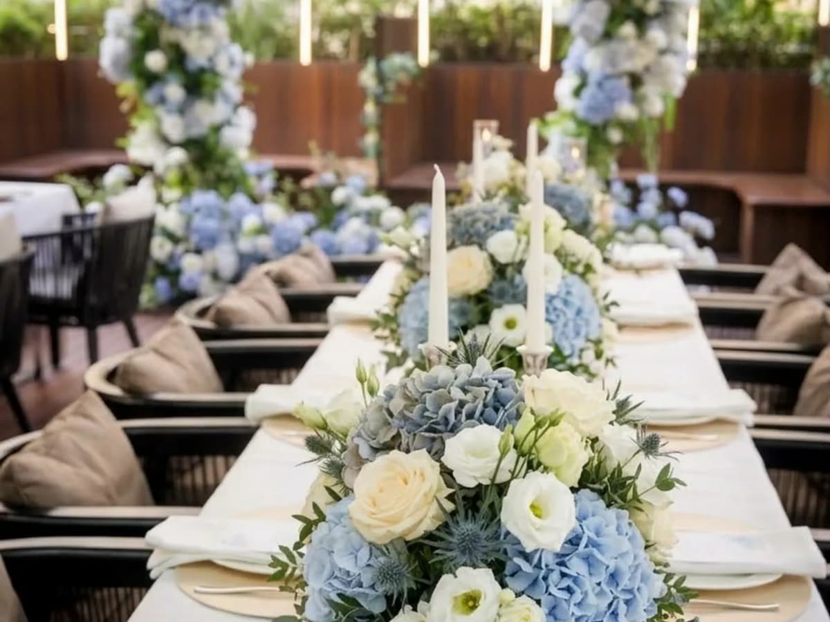 wedding table decorated with blue and white flowers at lebua thai event space in chijmes singapore