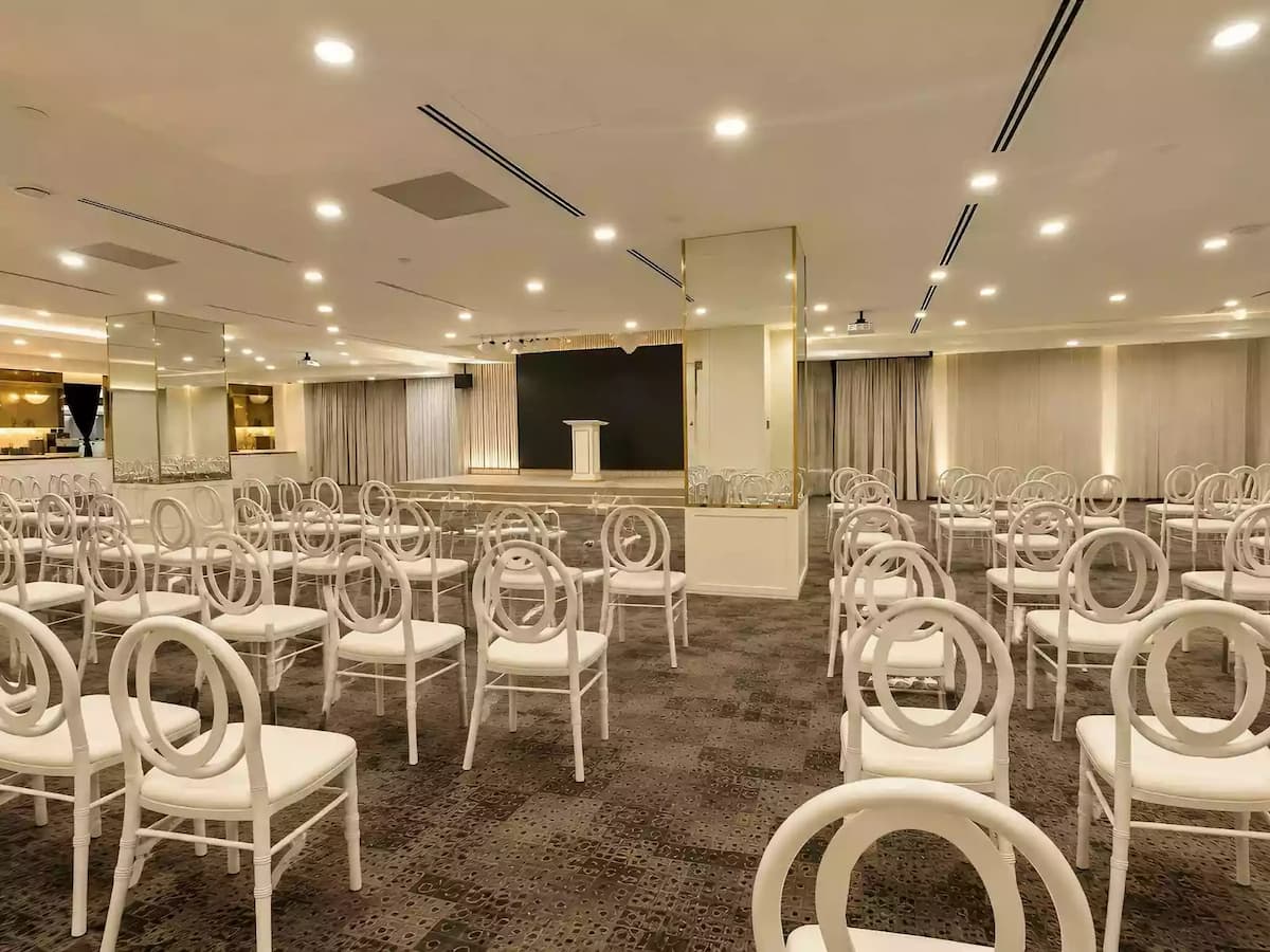 theatre style seating facing the stage at ivory by pu3 corporate event venue in somerset singapore