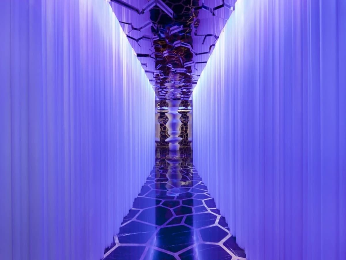 walkway in bar with honeycomb flooring and ceiling