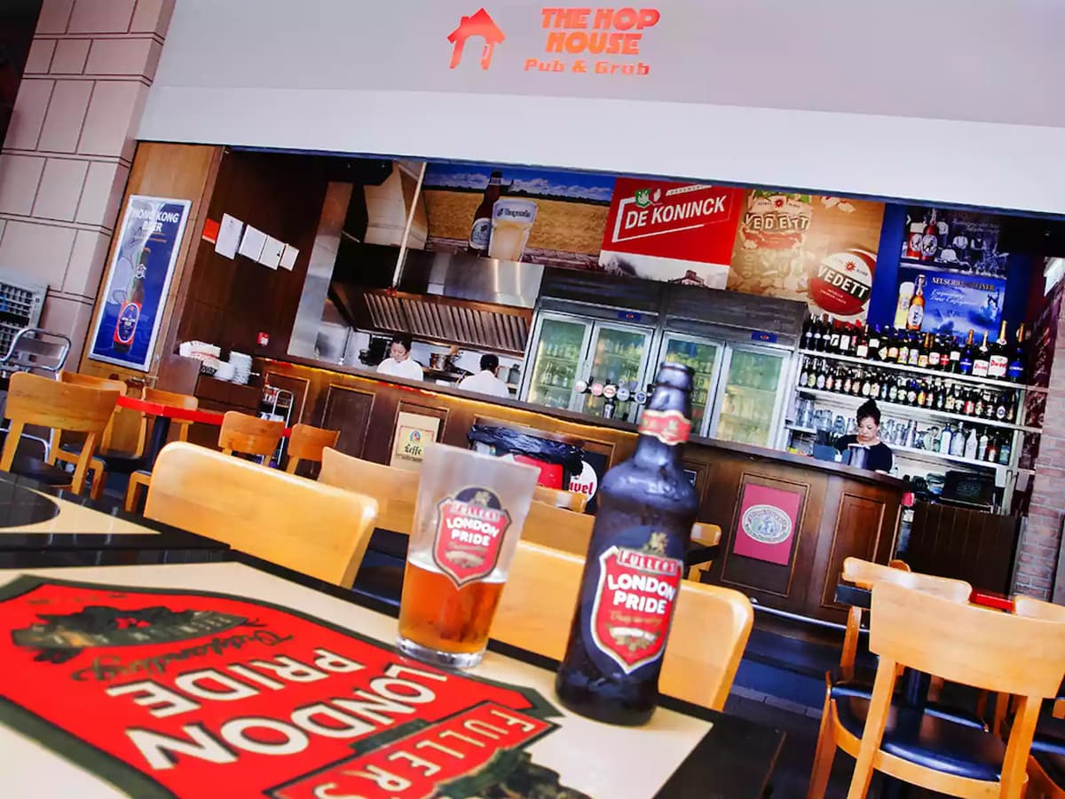 the hop house pub grub dining table with beer on top