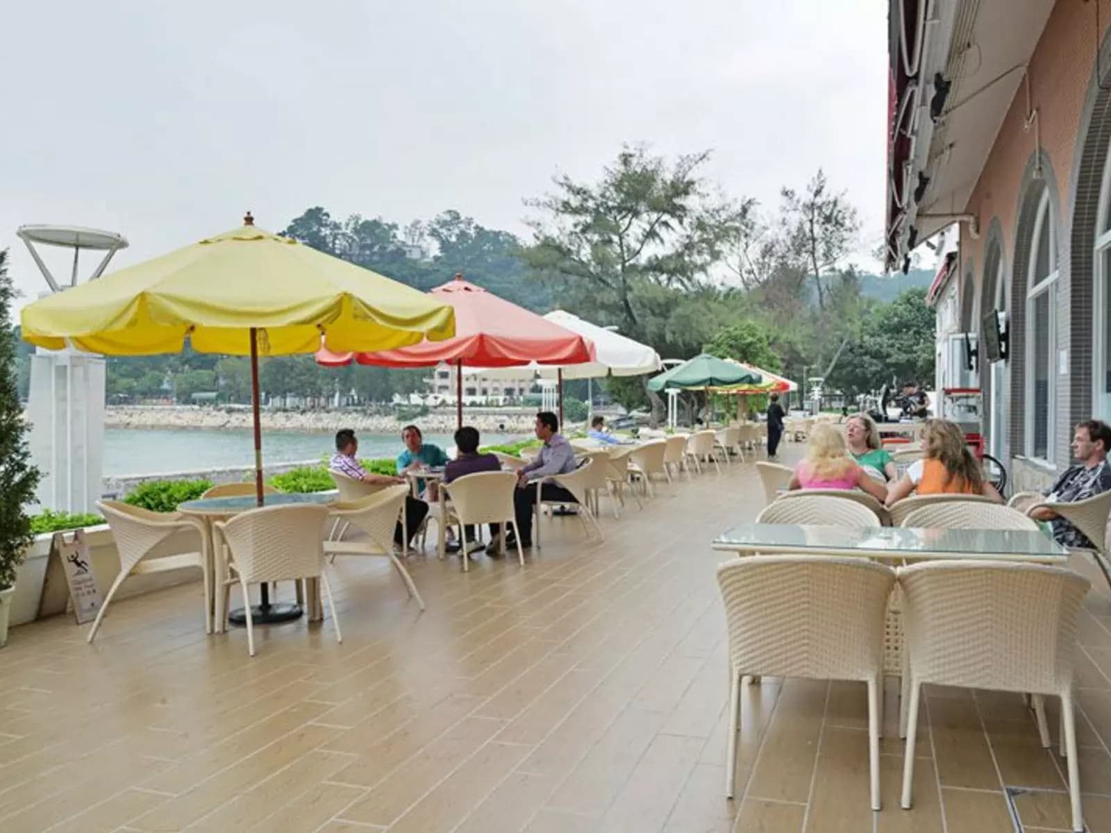casual outdoor dining establishment accompanied with the sea view and the warmth of the sun