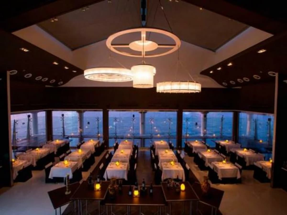 fine dining restaurant with floor to ceiling window featuring sea view of hong kong