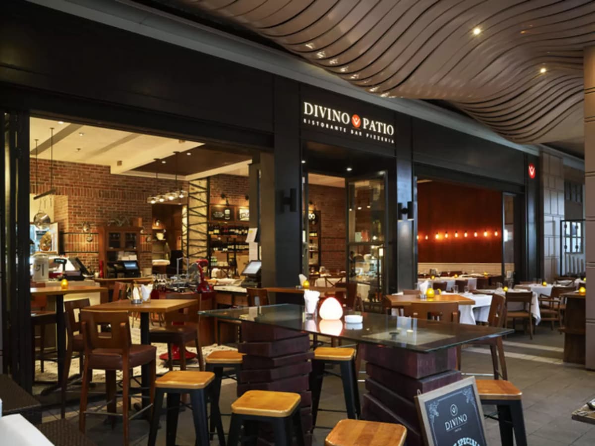outdoor seating area with alfresco in front of the front door of the restaurant