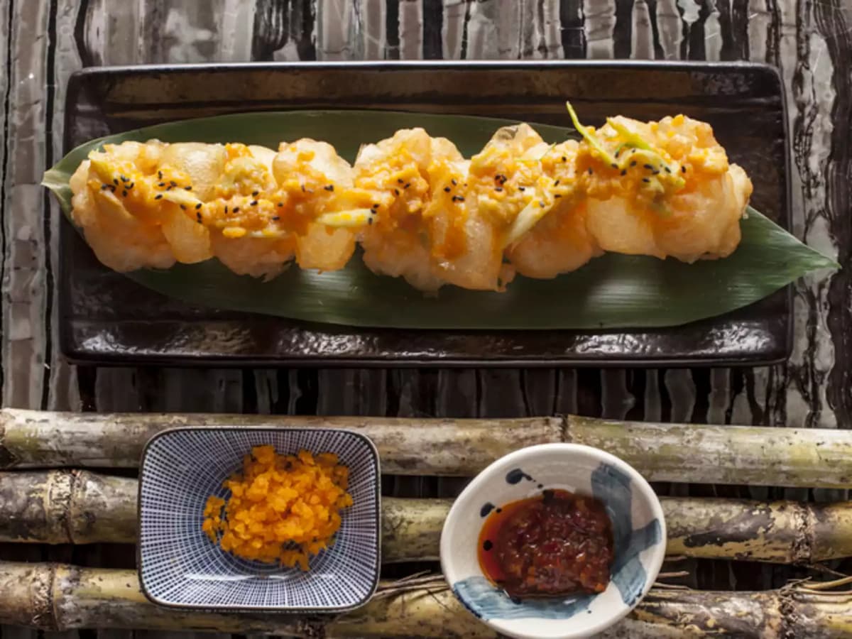 seafood cuisine and sauces on wooden table