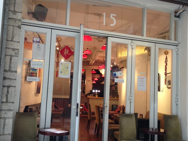 the front door of culture club gallery with ceiling to floor window