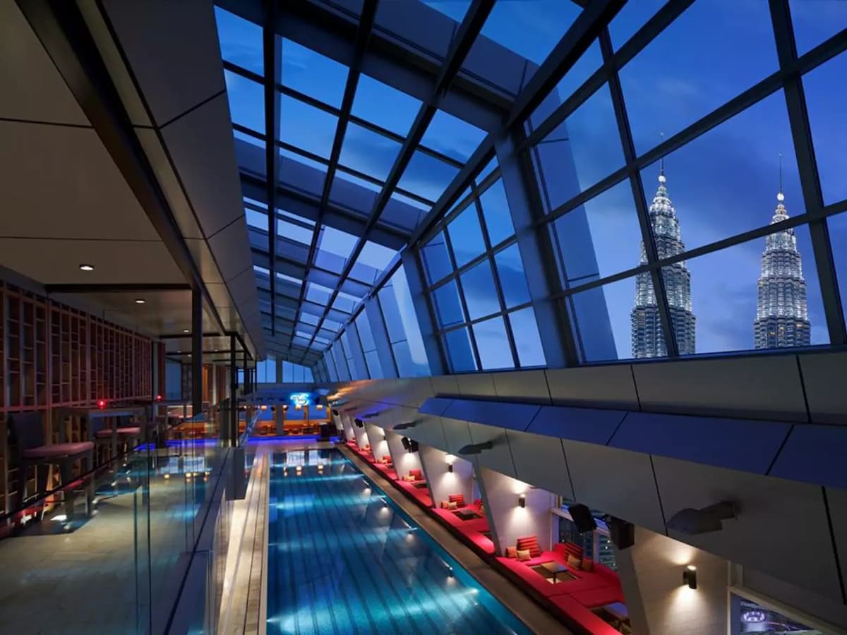 kuala lumpur bar with indoor sky pool and large glass roof