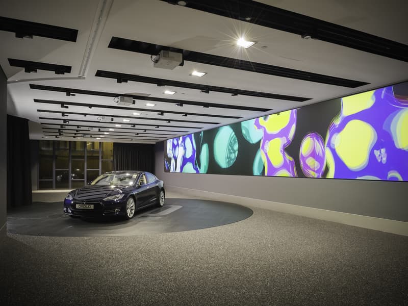 car launch event with long screen as the backdrop