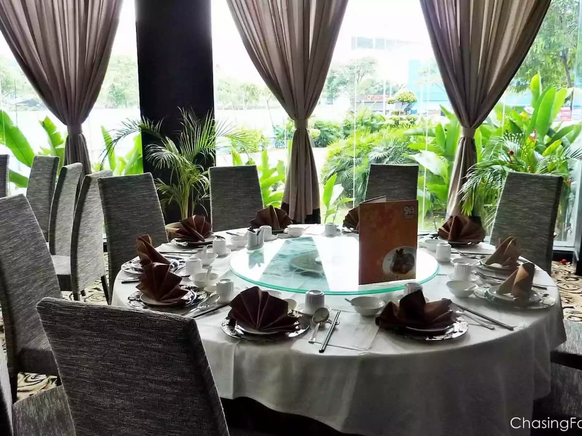 restaurant with round table setup filled with natural light