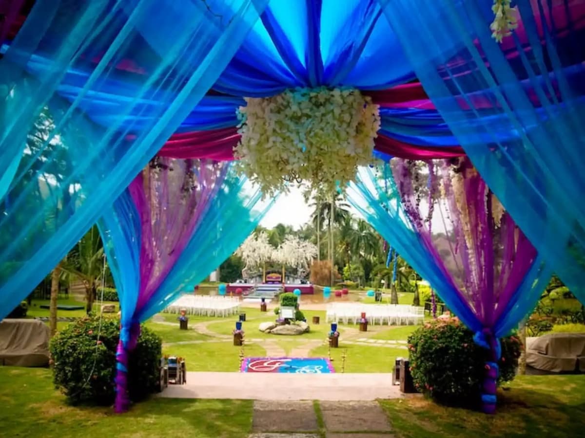malaysian wedding decoration with blue and pink fabric