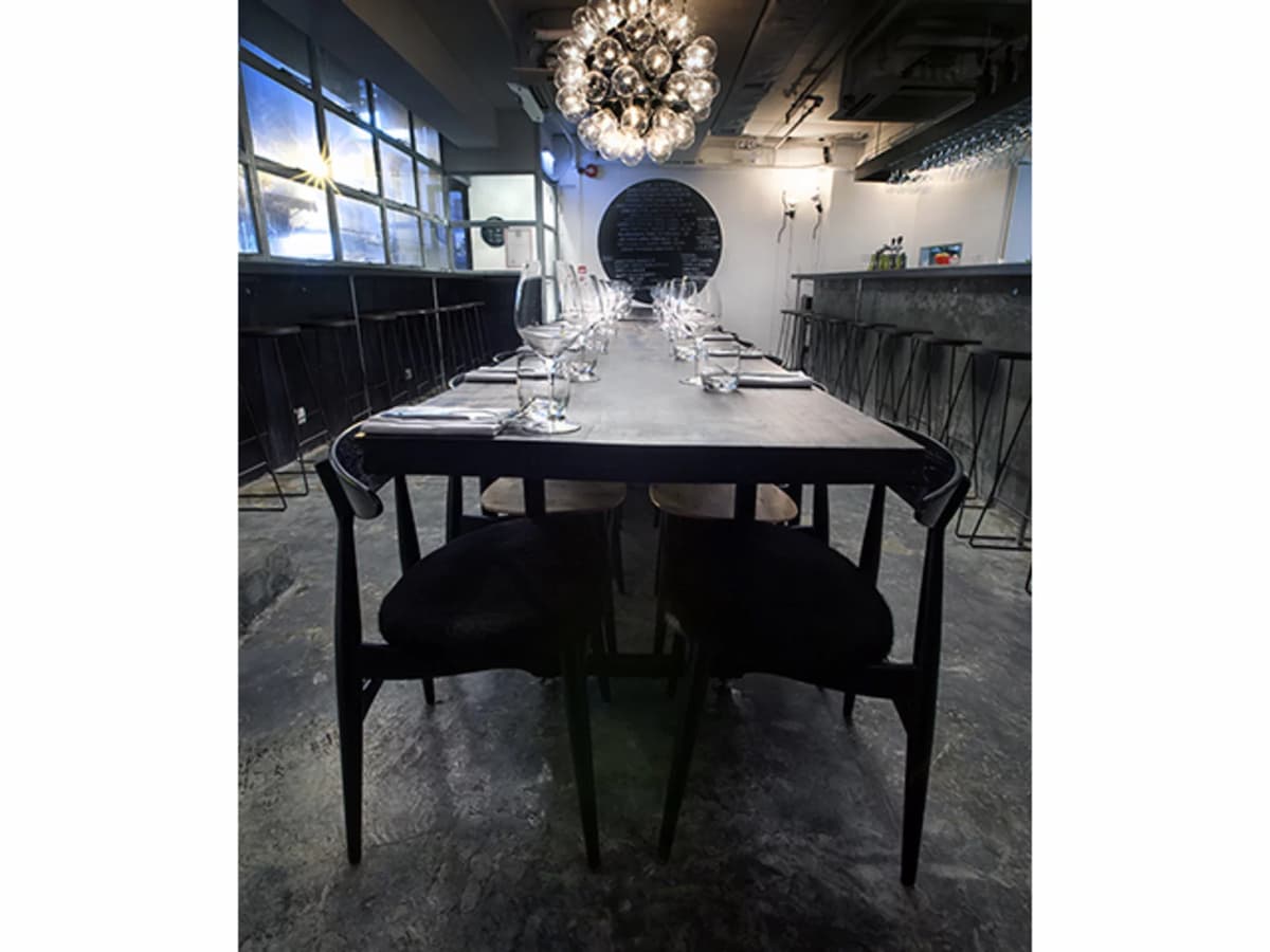 whitewashed walls and dark wood interiors give off a modern-industrial vibe