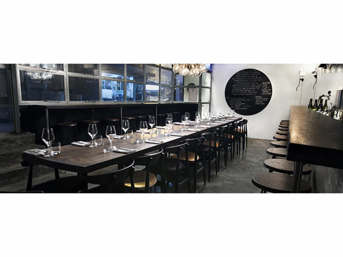 italian restaurant with sit down table setup and bar seating