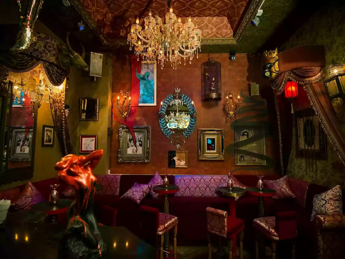 private party room with red velvet interior, curtains, and tassels